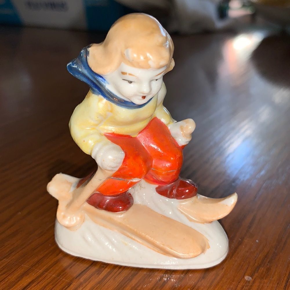 Vtg ceramic boy skiing figurine